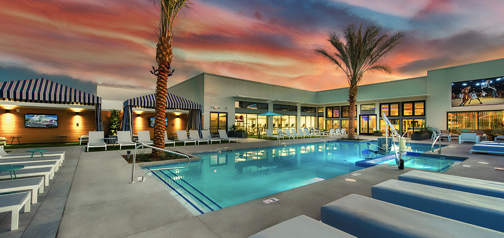 Rooftop pool with lounge chairs and cabanas